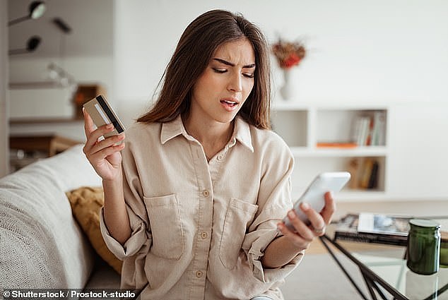 A customer of an Australian online store has expressed outrage at being asked for a tip when making a purchase. A woman is pictured looking at her mobile phone