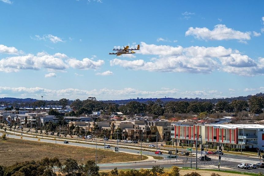 A drone flies high above a Canberra suburb.