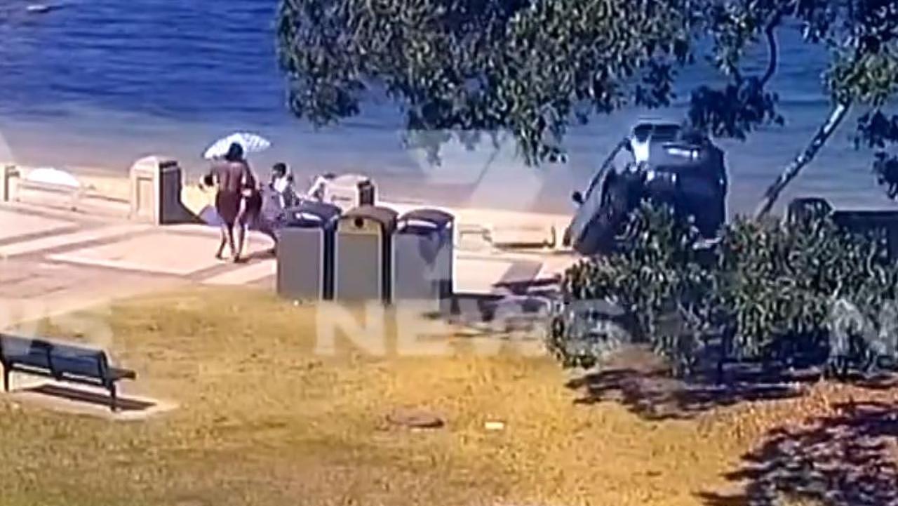 The car strikes the concrete wall and rolls onto the sand as families duck for cover. Picture: Supplied / Channel 7
