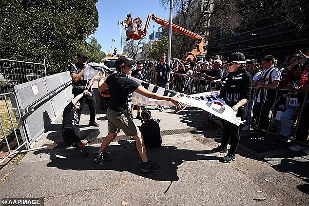 The protestors were seen wearing T-shirts that had the slogan 'can't play footy in 50 degrees'