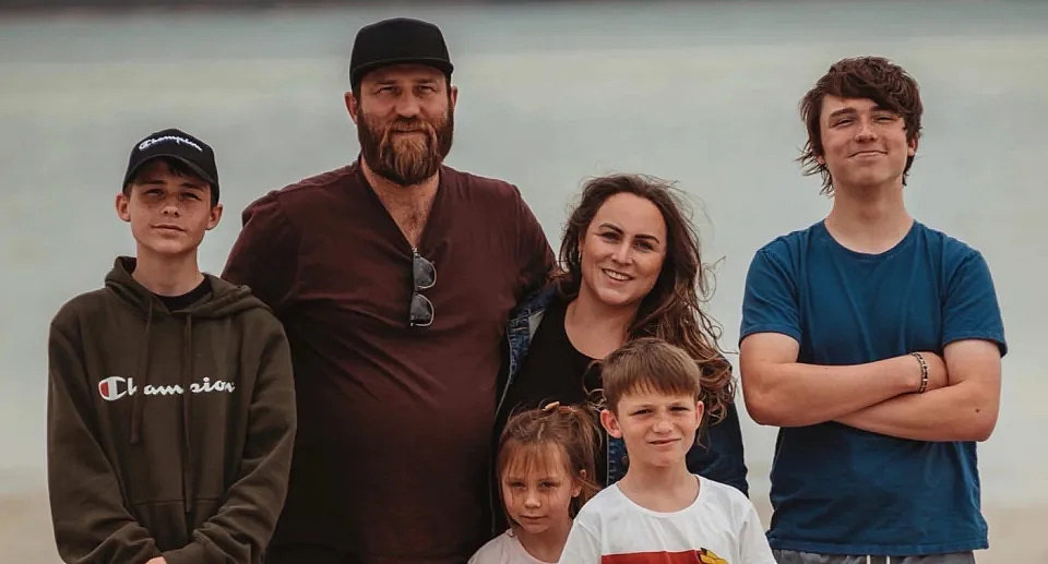 Travis Muir with his wife and four children