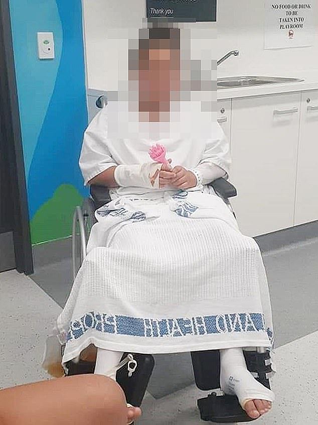 The girl (pictured) suffered a severe vaginal tear which required two operations and four nights in Logan Hospital