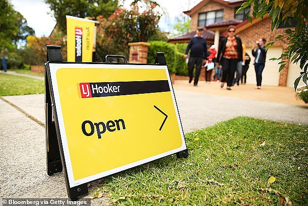 While capital city rents have soared by 16 per cent during the past year, monthly mortgage repayments have surged by an even more dramatic 63 per cent, following the RBA's 12 interest rate increases in little more than a year (pictured is an LJ Hooker sign in Sydney)