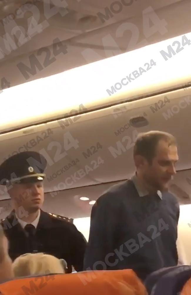 Airline passenger, Alexey Fursov, was filmed being hogtied after allegedly repeatedly stabbing a fellow passenger with a metal fork on a nine-hour flight from Bangkok to Moscow. Picture: East2West