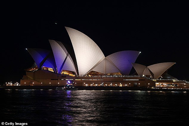 The sails were lit up in a muted blue and white pattern in support of Israel