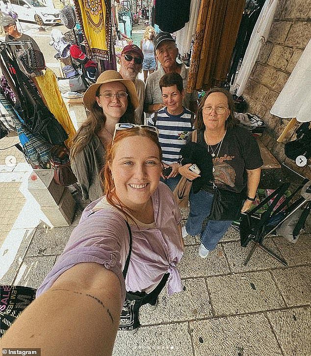 Asher Lilley is pictured at the front, with her family in Israel before war broke out on Saturday