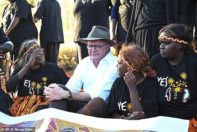 Mr Albanese was seen welling up as traditional owners of the land danced and sang while holding his hands