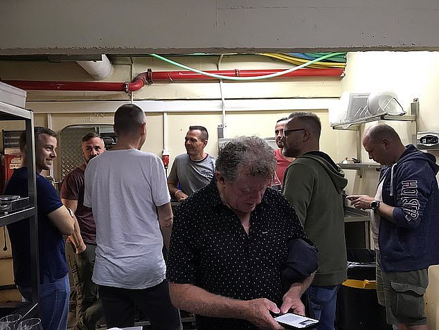 Pictured: Tour guide Paul West, pictured front, and other members of the group in a bomb shelter in Tel Aviv