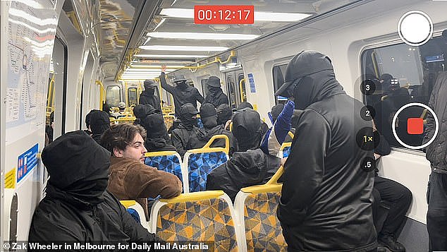 On the train the group handed out racist fliers sang the Advance Australia Fair and another racist pro-white power anthem