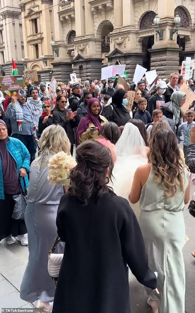 A bride has been delayed from her big day after thousands of pro-Palestine protestors blocked off the street in front of the reception in Melbourne on Sunday (pictured)