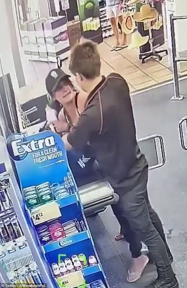CCTV footage shows the staff member grabbing the woman's bag to look for allegedly stolen goods before she rushed back and attacked him