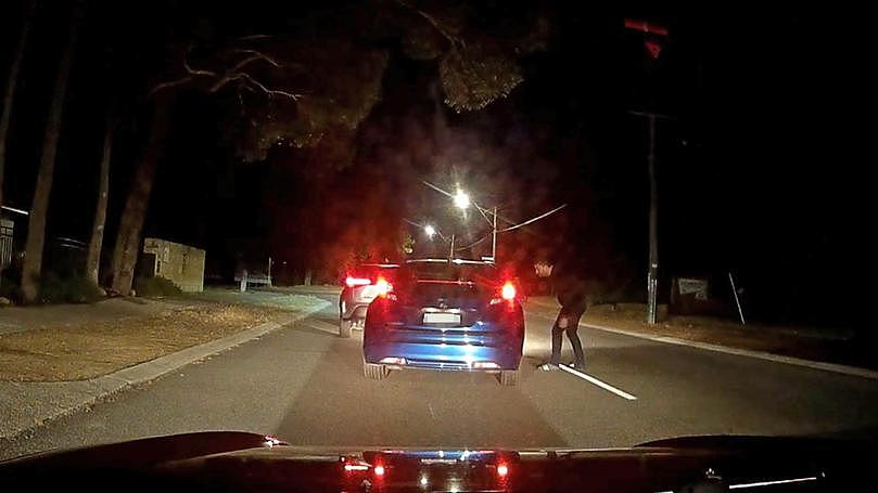 Shocking footage has emerged of a road rage incident in Kalamunda, which shows an aggressive driver swerving into oncoming traffic in a bid to confront the other driver.