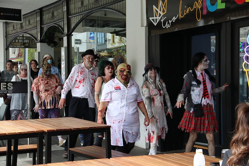 people dressed up as zombies parade around warrnambool