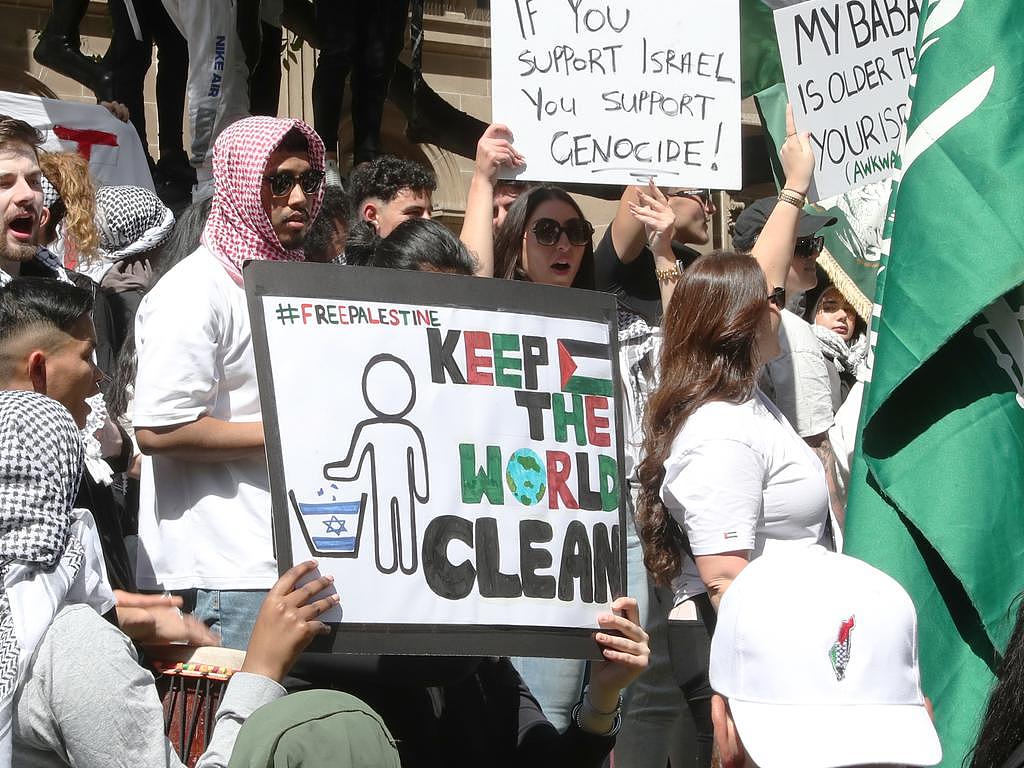 Signs held at Sunday’s pro-Palestine rally in Melbourne’s CBD. Picture: David Crosling