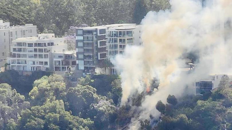 A bushfire is burning dangerously close to apartments near Kings Park.