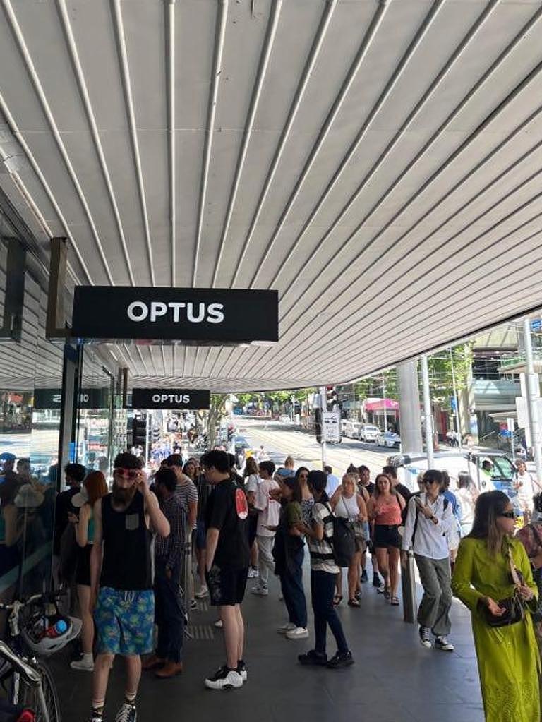 Customers waiting outside an Optus store in Sydney’s CBD. Picture: Supplied