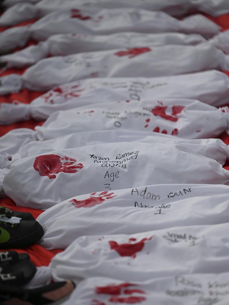 Each cloth was marked with a red child’s handprint, and the name and age of a child who had died in the conflict Picture: NCA NewsWire / Martin Ollman