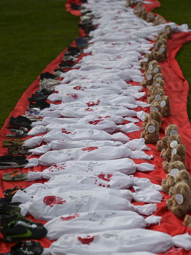 The cloths were placed between teddy bears and small pairs of shoes. Picture: NCA NewsWire / Martin Ollman