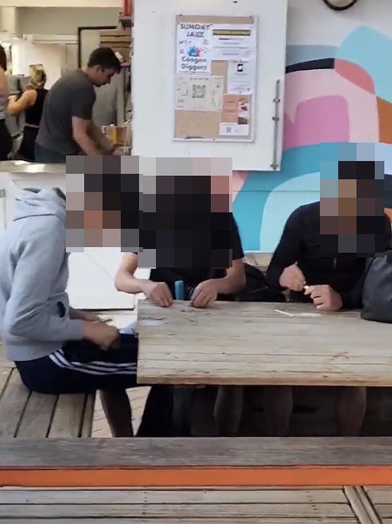 The video of boys appear to show them cutting white power at Coogee.