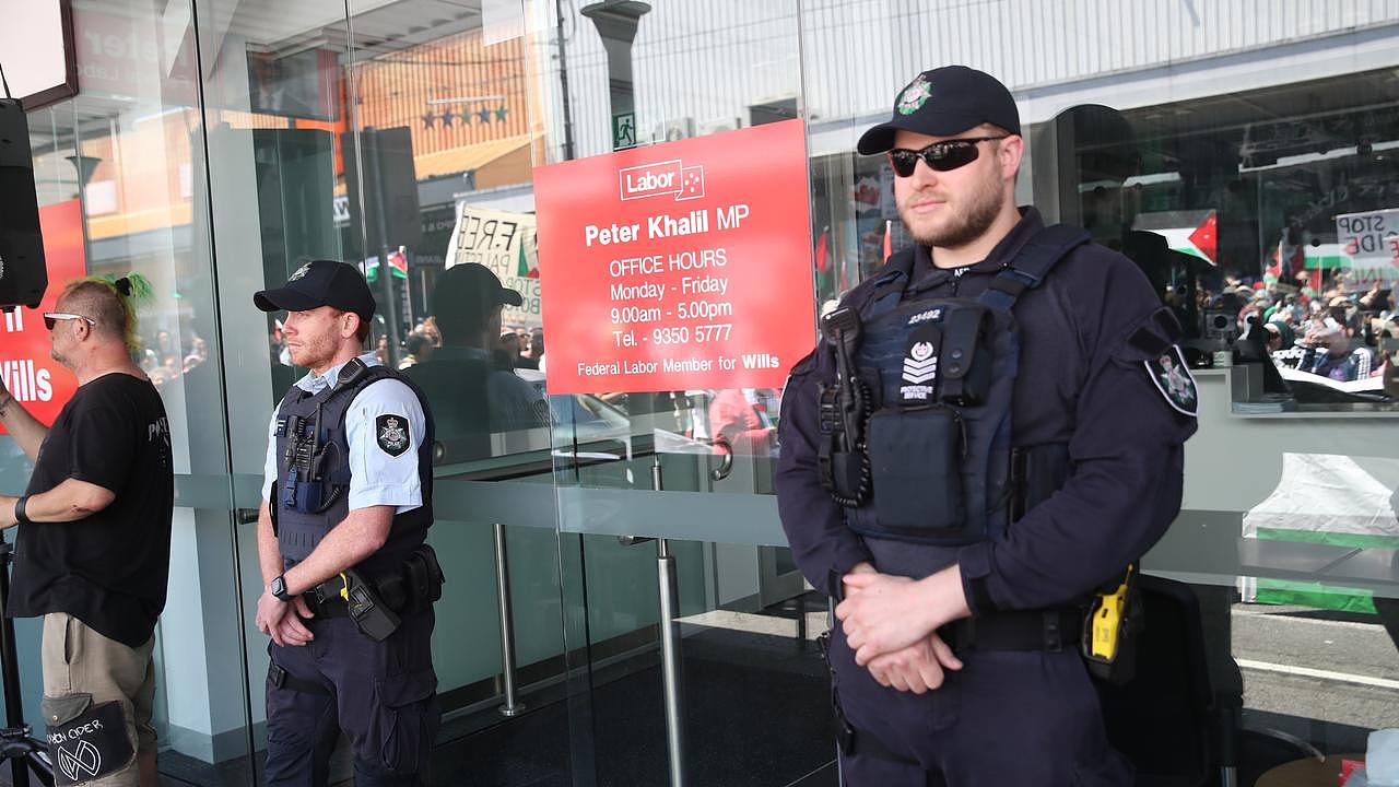 Police stand guard at the entrance to Mr Khalil’s office. Picture: NCA NewsWire / David Crosling