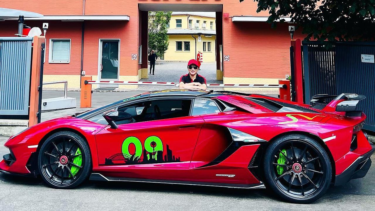 Huynh poses with a Lamborghini. Picture: Instagram