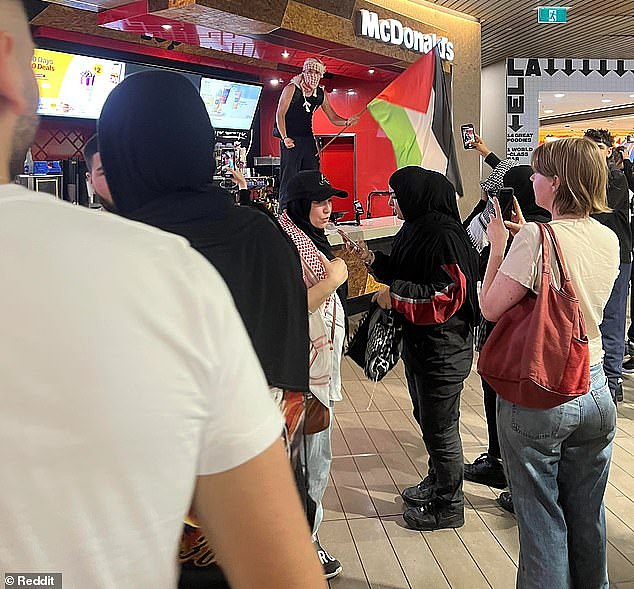Melbourne Central was inundated with pro-Palestine supporters on Thursday, including a male who jumped onto the counter at McDonald's