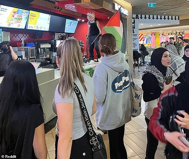 Pro-Palestine supporters marched down Swanston Street to Melbourne Central Shopping Centre where many congregated in the food court