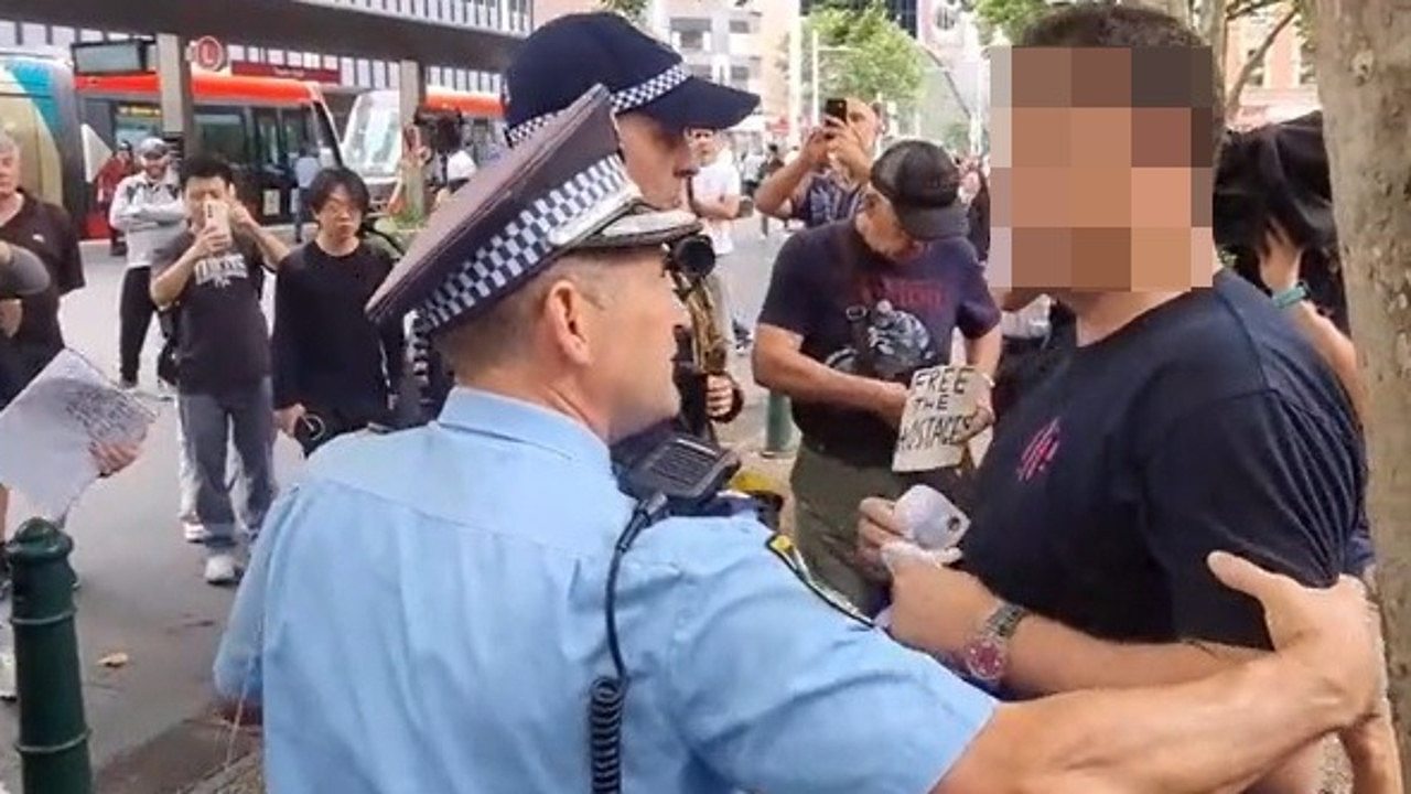Officers asked the man to put his flag away, which he refused to do. Picture: Arkangel_Sydney / TikTok