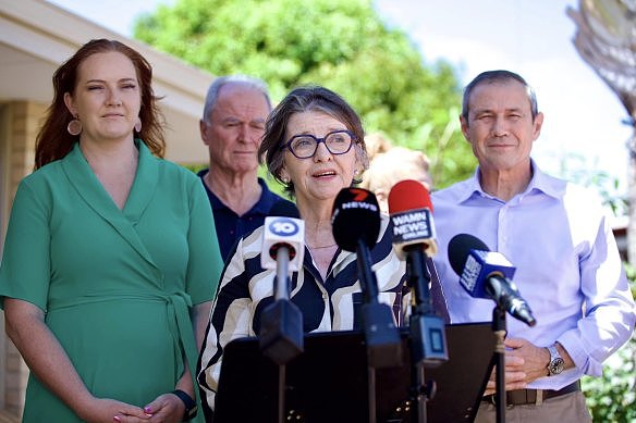 Janet McLeod speaks to the media with Kingsley MLA Jessica Stojkovski and Premier Roger Cook.