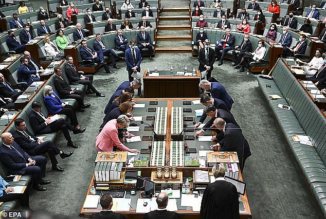 The Joint Standing Committee on Electoral Matters - made up of Labor, Coalition, Greens and independent politicians - said more MPs and senators are needed to ensure the electoral system is made fairer for every Australian. The House of Representatives is pictured