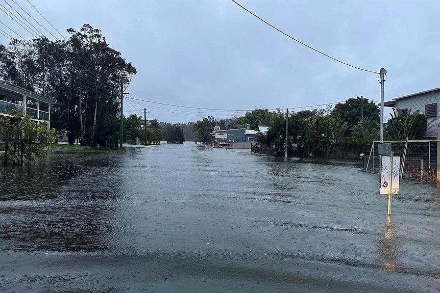 The flooded main drag of a country town.
