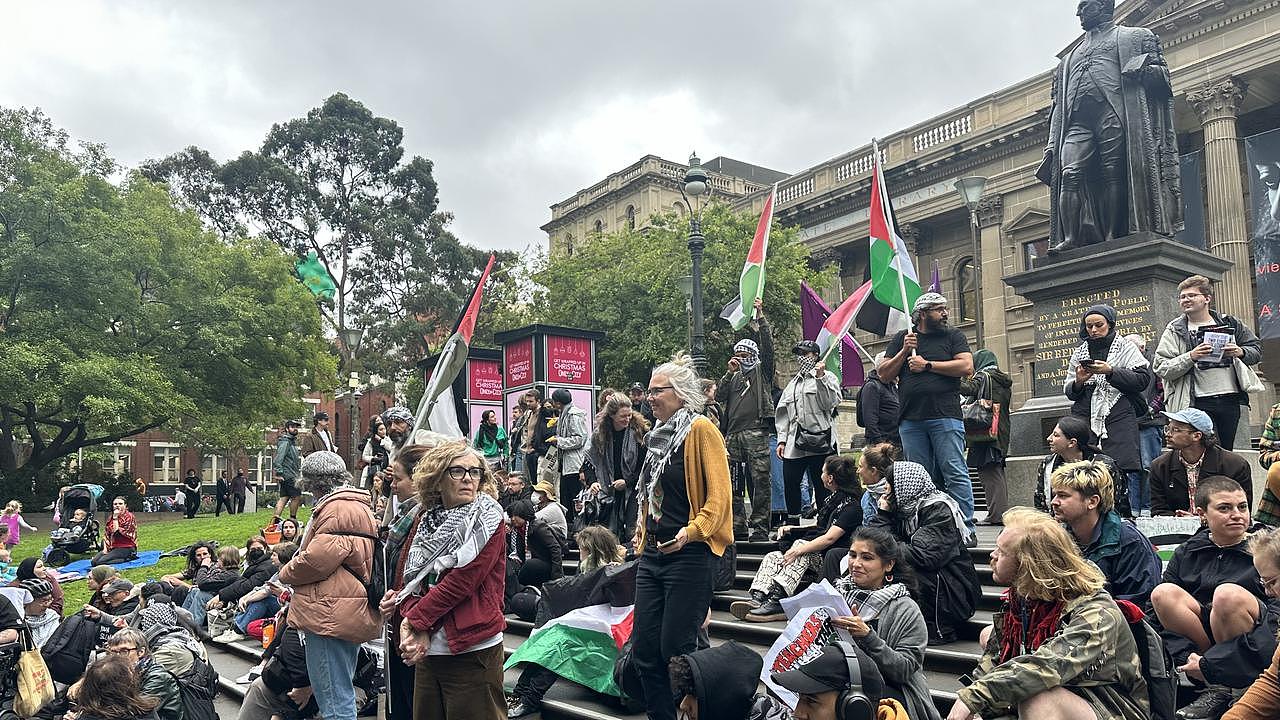 Teachers and school staff at the State Library for a vigil to mourn the thousands of children killed in Gaza. Picture: Suzan Delibasic