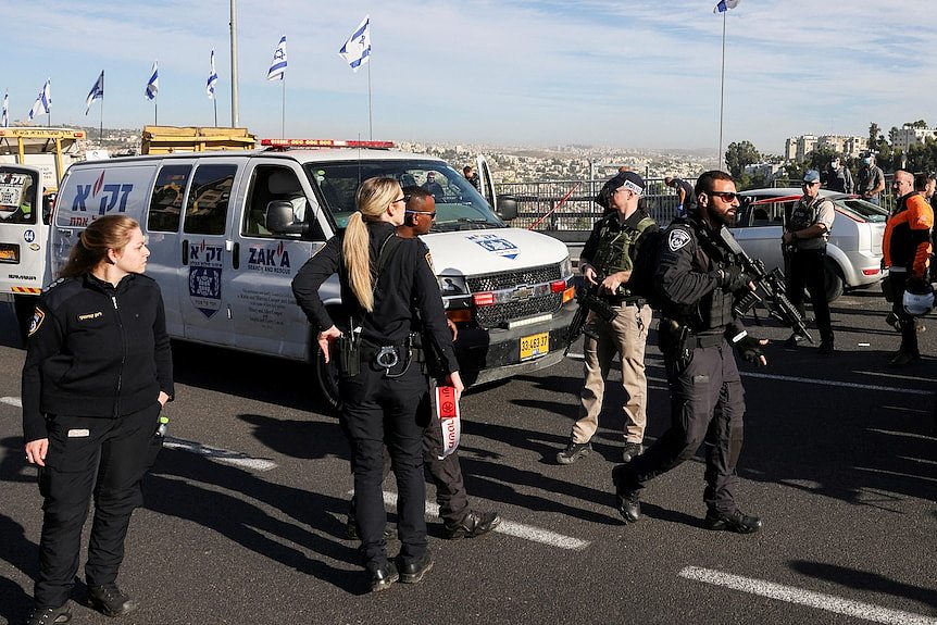 Israeli officials work at the scene of a violent incident in Jerusalem
