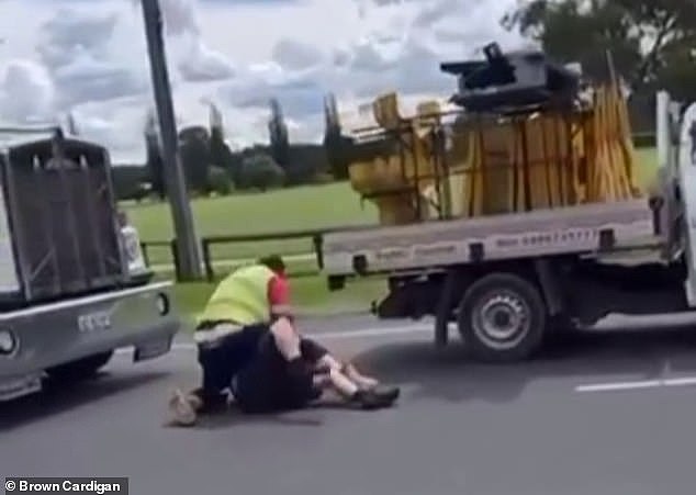In a video shared online, two men are seen in a heated brawl in the middle of the road in Bathurst after a traffic incident