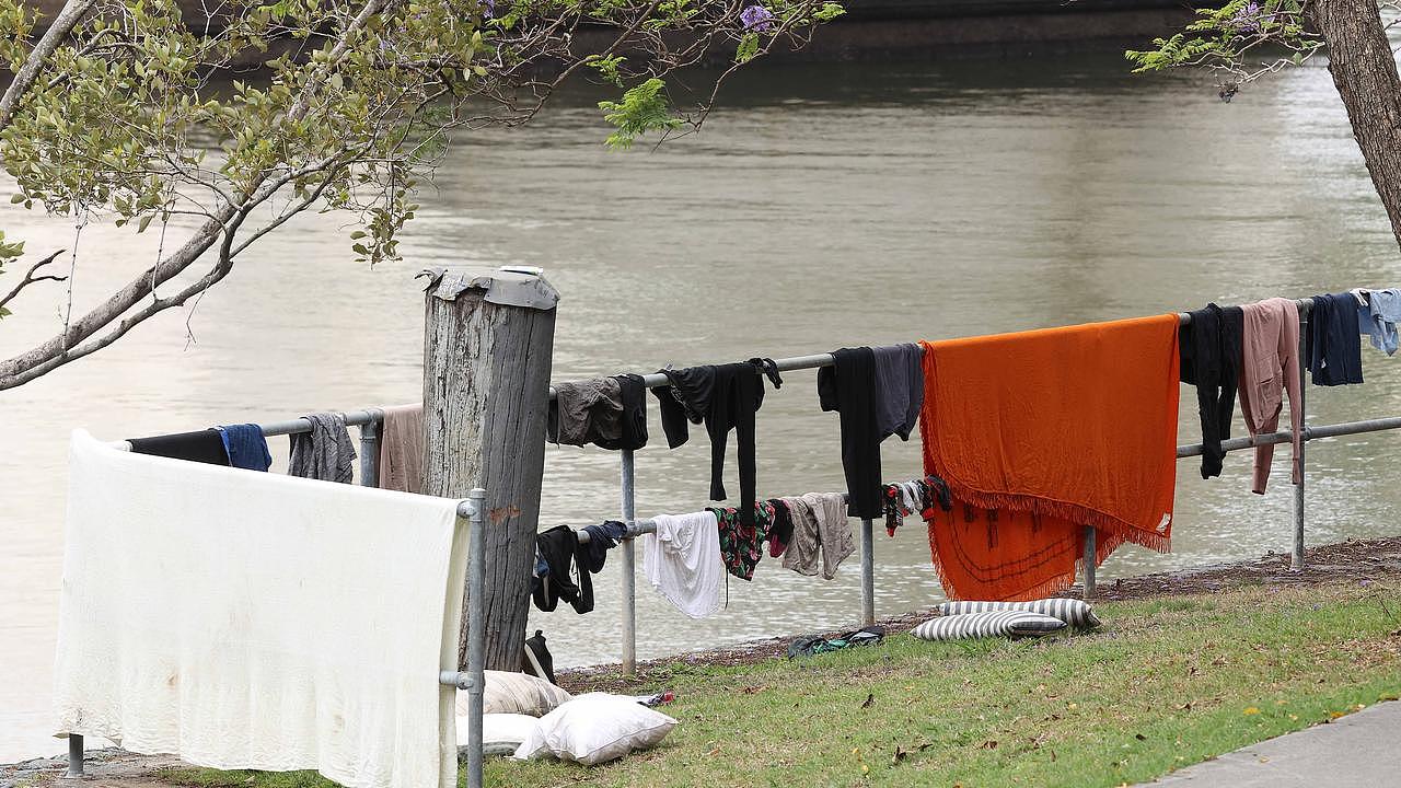 Homeless washing their cloths by the river, under William Jolly Bridge, South Brisbane. Picture: Liam Kidston