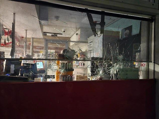 Businesses in Alice Springs' CBD have been forced to install new security measures as crime in the area continues (pictured, a business attack in Alice Springs last Tuesday)