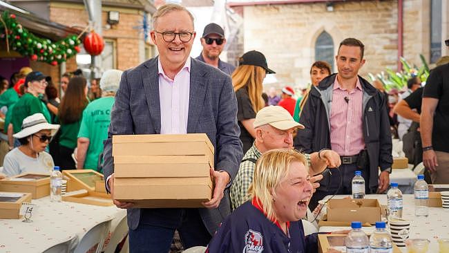 PM Anthony Albanese delivers lunches at the Bill Crews Foundation Christmas Lunch in Ashfield. Photographer: Thomas Parrish