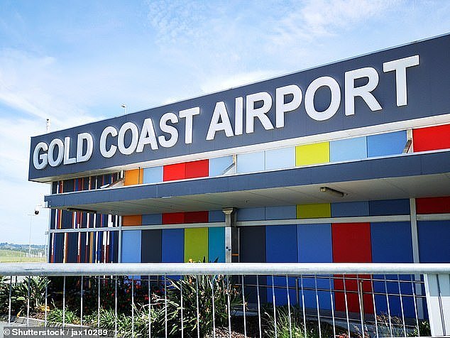 There were chaotic scenes at Gold Coast Airport (pictured) on New Year's Eve, when a Victorian woman was arrested after allegedly attacking airline staff