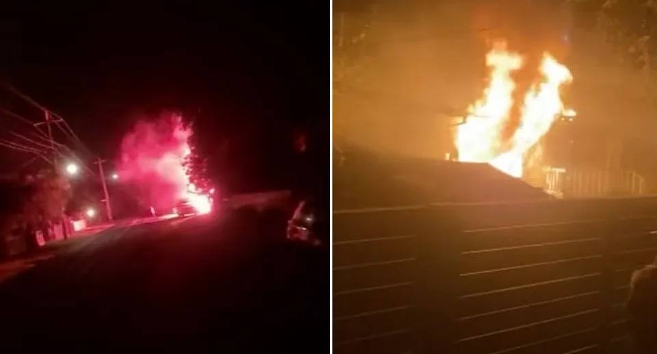 Fireworks going off on the street (left). The house in flames on the right. 