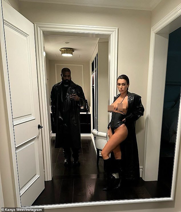 On Tuesday, the 46-year-old hitmaker also shared a mirror selfie of himself standing in a doorway covered head-to-toe. In the same snap, Censori stood to the side, while modeling a barely-there string bikini, a black corset and a leather trench coat