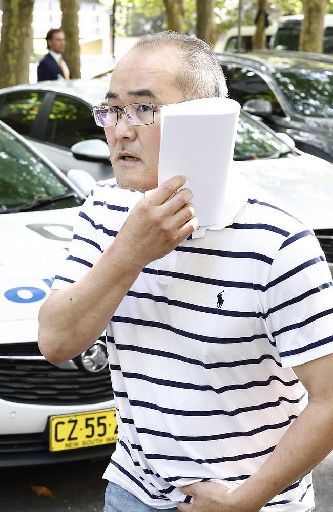 Sang Lee leaving Surry Hills Police Station. Picture: Richard Dobson