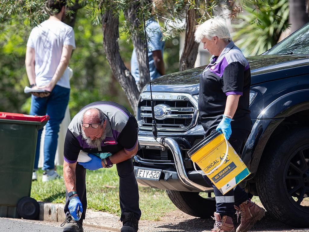 Forensic cleaners outside the Toongabbie home on Saturday. Picture: Julian Andrews
