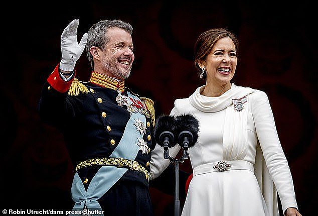 Queen Mary was a vision in white as she waved to fans on the balcony of Christiansborg Palace in Copenhagen alongside her husband King Frederik X on Sunday (pictured)