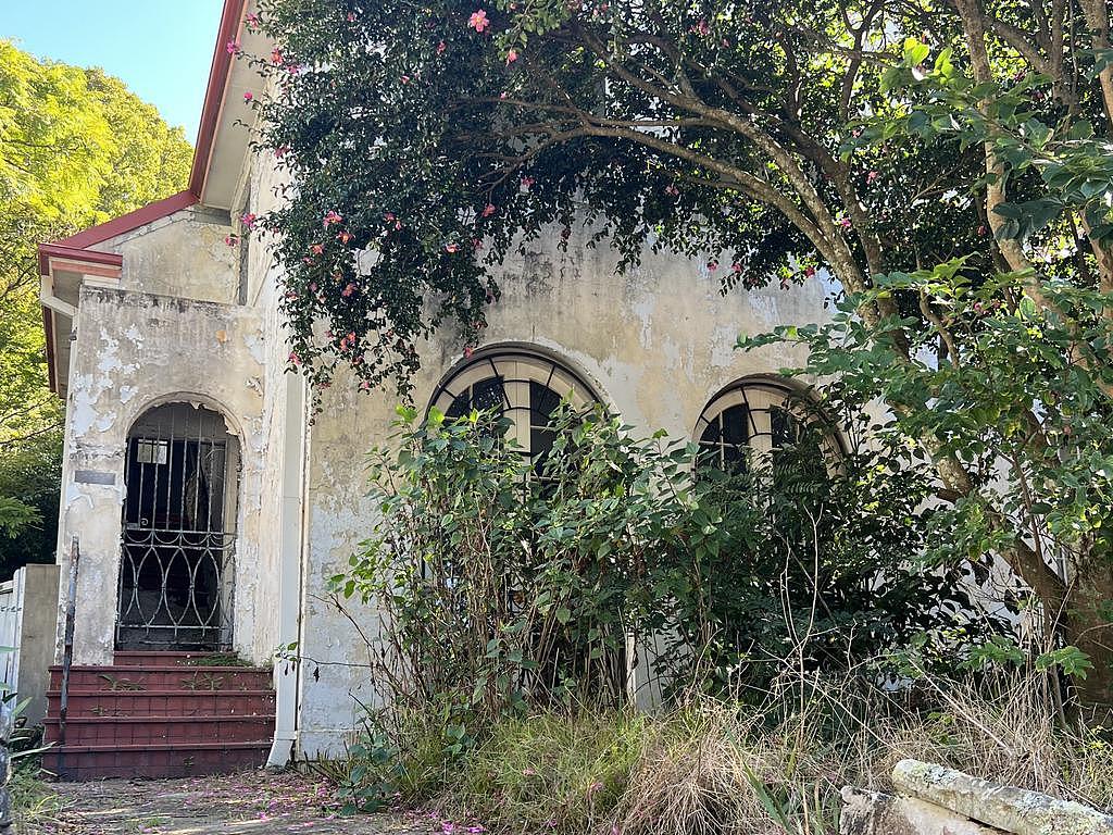 The beautiful but derelict house.