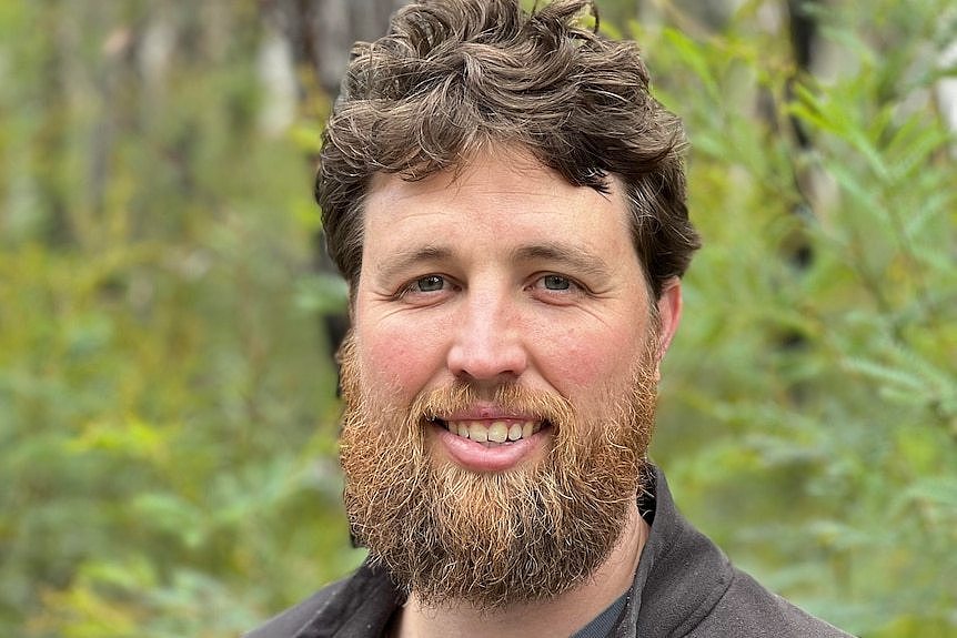 A caucasian man with a large ginger beard