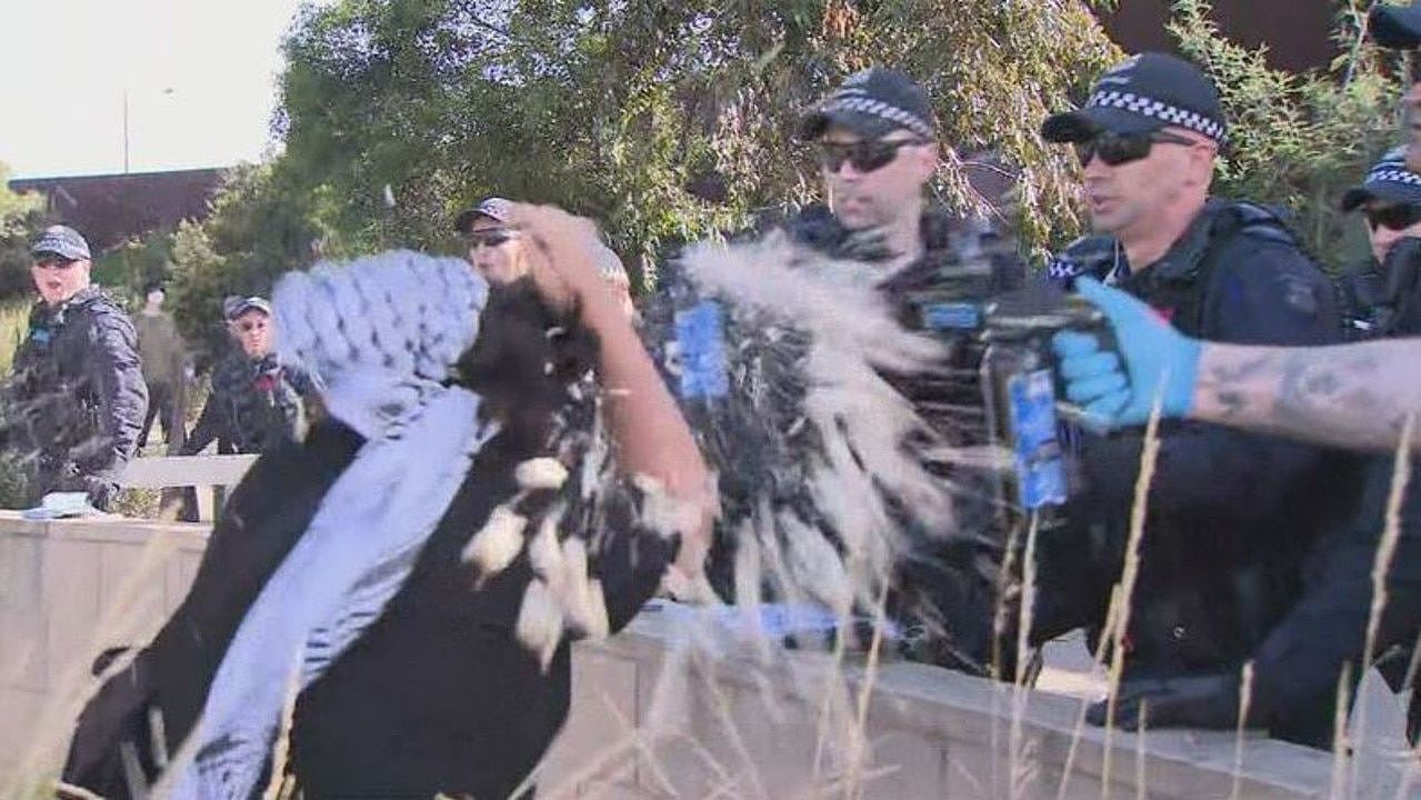Police pepper spray protesters at Port Melbourne on Monday. Picture: Nine