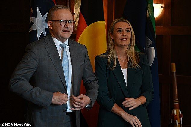 Prime Minister Anthony Albanese (seen above with partner Jodie Haydon on Wednesday) told the National Press Club he backflipped because of changing economic conditions