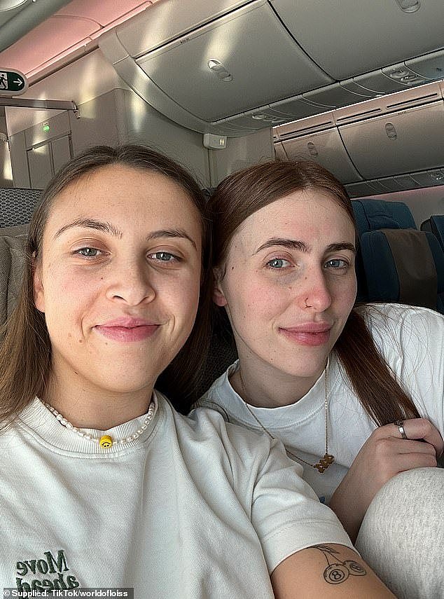 Two days after arriving her left calf became swollen, 'warm' and felt like she had 'pulled a muscle' (Lois pictured left with her partner on the flight)