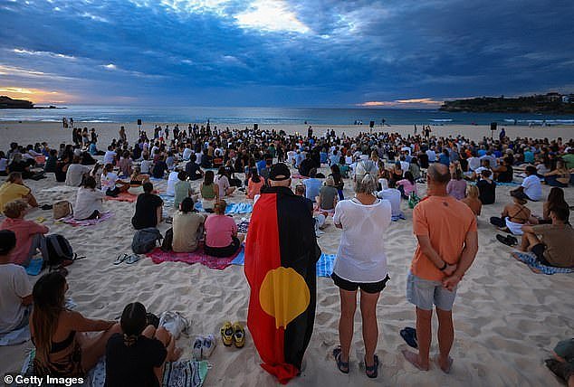 Thousands of Australians have greeted the dawn of a scorching hot Australia Day at Indigenous beachside and parkland ceremonies across the country (pictured, Bondi Beach on Friday)