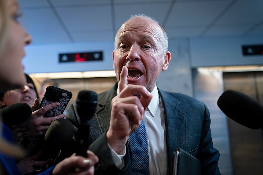 David Calhoun the CEO of Boeing holds his finger up as he talks to media in Washington DC